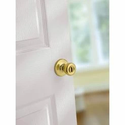 Kwikset Tylo Polished Brass Bed/Bath Door Knob Featuring Microban Antimicrobial Technology with Lock -Kwikset Sales Shop kwikset privacy door knobs 300t 3 6al rcs v1 1d 1000